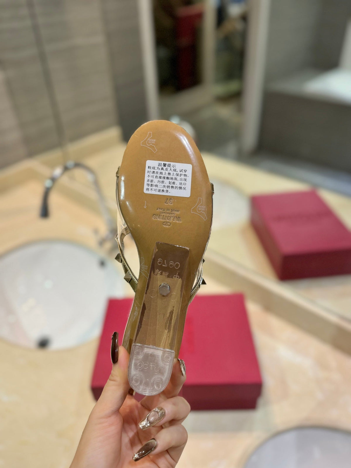 ROCKSTUD MULE SANDALS IN GOLD CALFSKIN AND TRANSPARENT PVC FILM