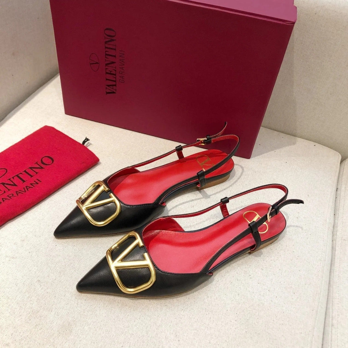 VLOGO SIGNATURE BLACK CALFSKIN FLAT SLINGBACK PUMP WITH GOLD LOGO